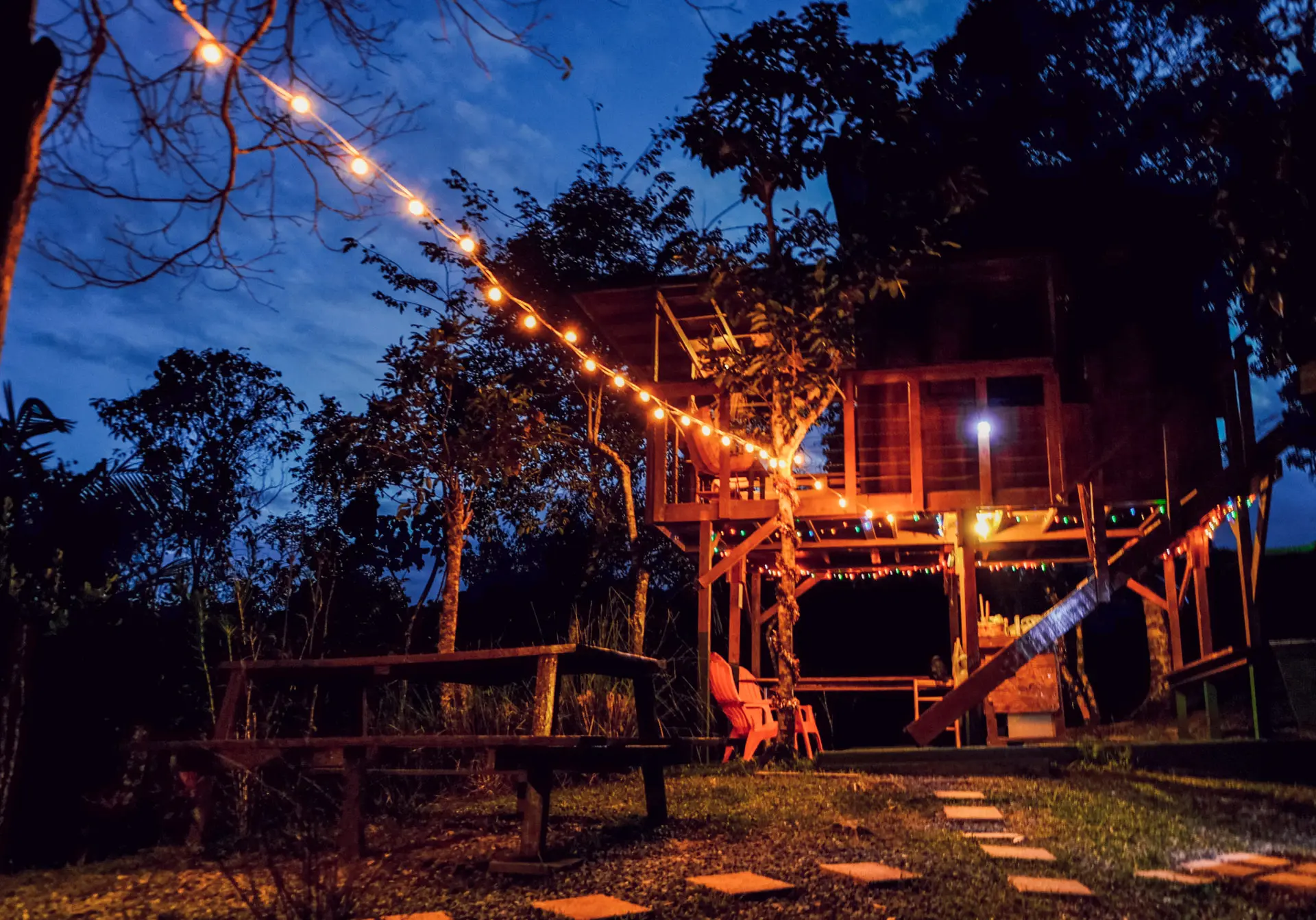 string lights on puerto rico treehouse at night