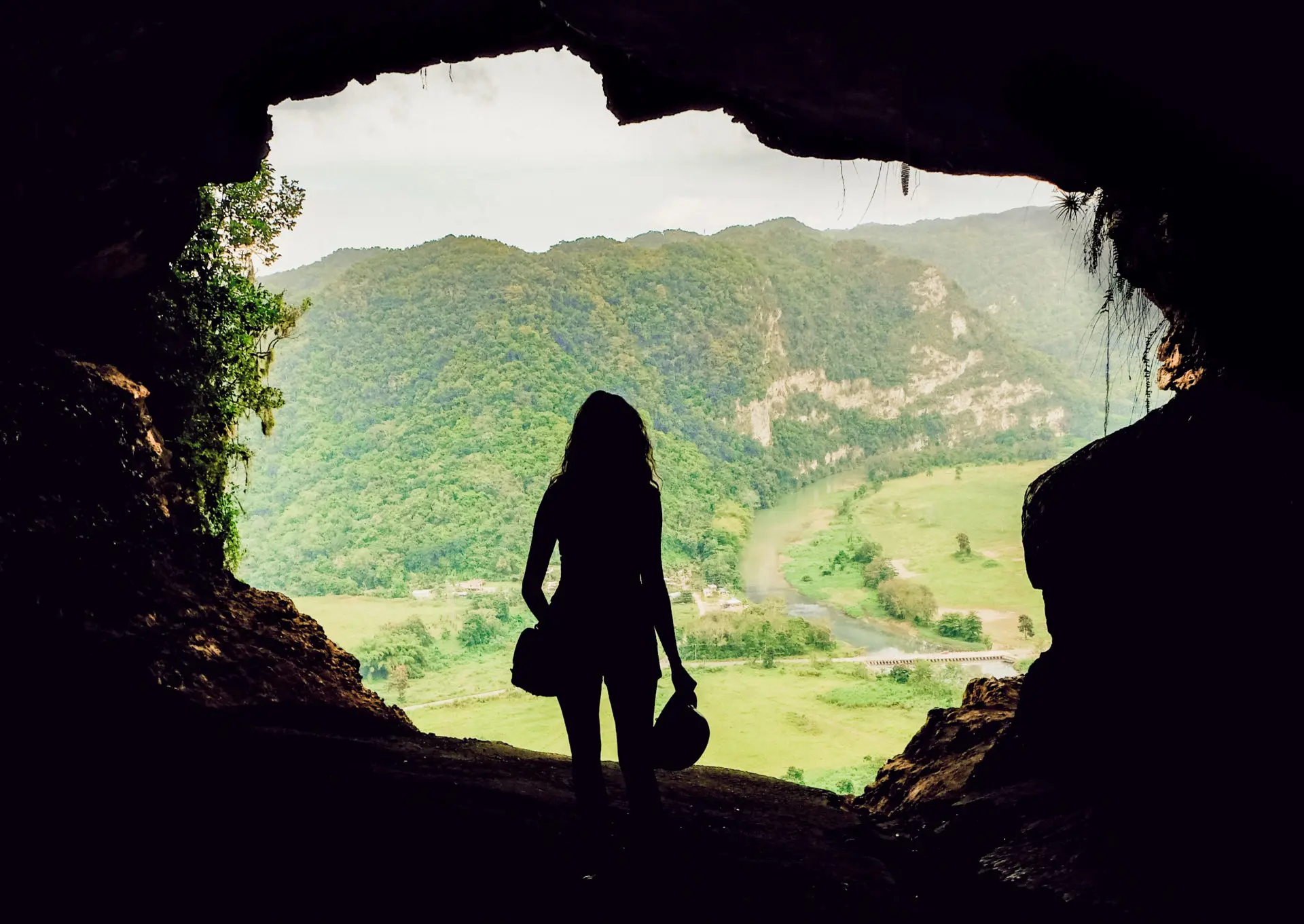 travel blogger standing on window cave hike in puerto rico near san juan